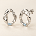 Tidal Aperture earrings — AI design rendering